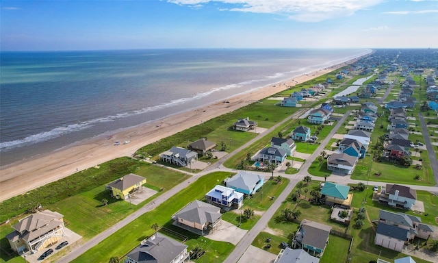 aerial view featuring a water view and a beach view