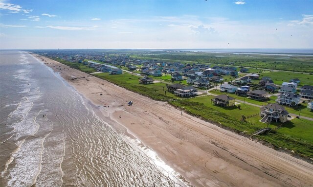 bird's eye view featuring a beach view and a water view