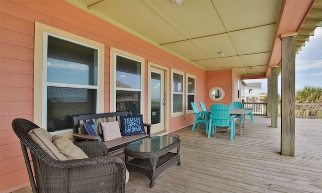 wooden terrace featuring an outdoor hangout area