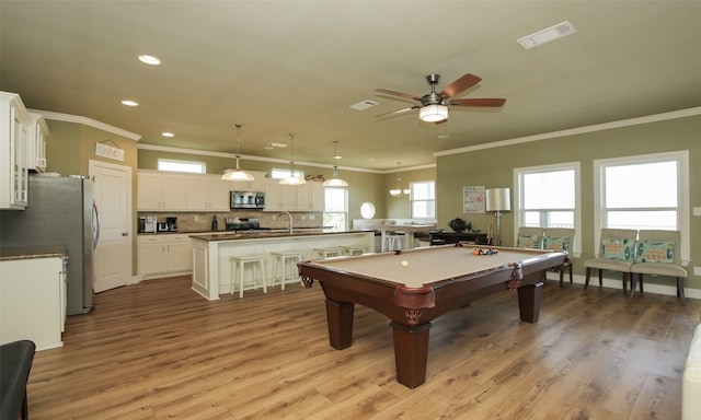 game room featuring crown molding, pool table, ceiling fan, and light hardwood / wood-style flooring