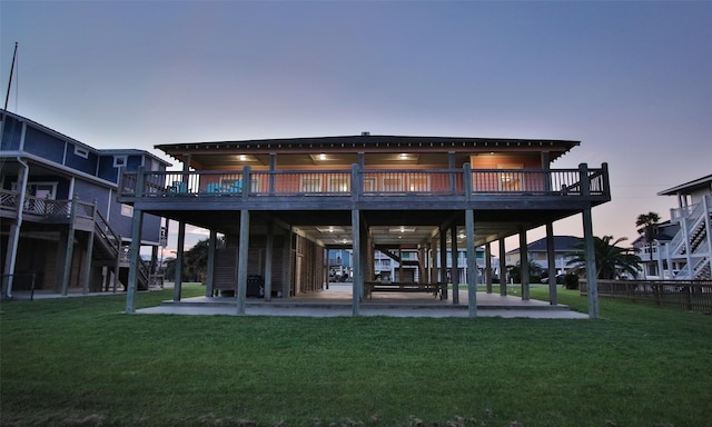 back house at dusk with a yard