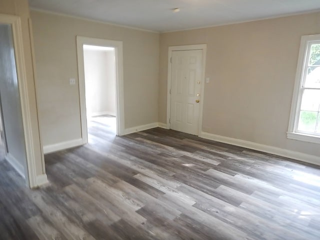 spare room with dark hardwood / wood-style flooring