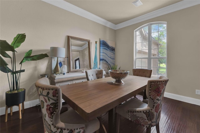 dining area with dark hardwood / wood-style flooring and ornamental molding