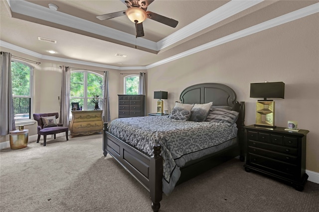 bedroom featuring multiple windows, ceiling fan, and ornamental molding