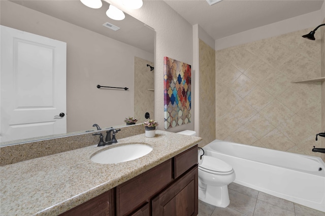 full bathroom featuring tile patterned flooring, vanity, toilet, and tiled shower / bath