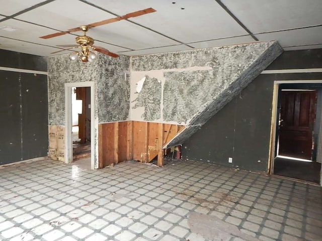 interior space with tile patterned flooring and ceiling fan