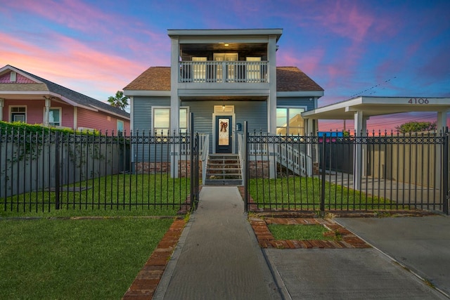 view of front of house featuring a porch, a balcony, and a lawn