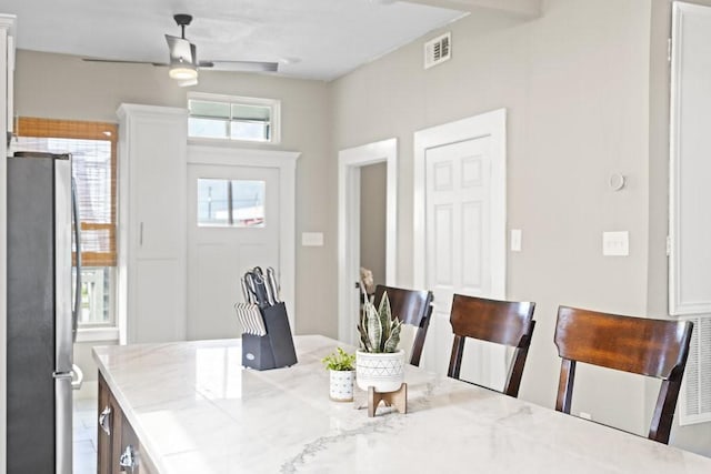 dining space featuring ceiling fan