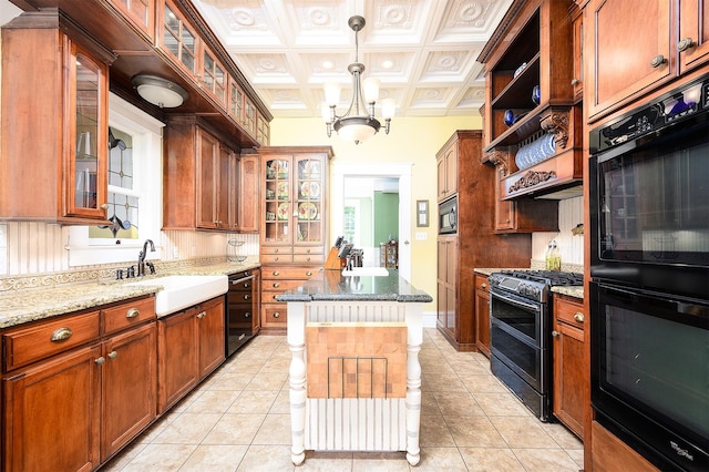 kitchen with open shelves, a sink, a center island, light stone countertops, and black appliances