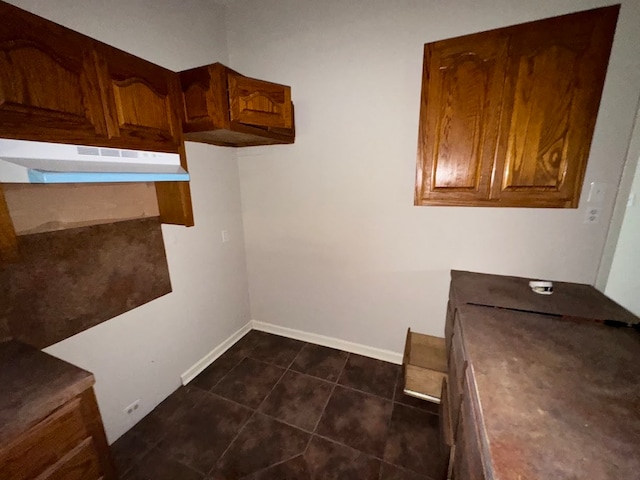 interior space with dark tile patterned floors