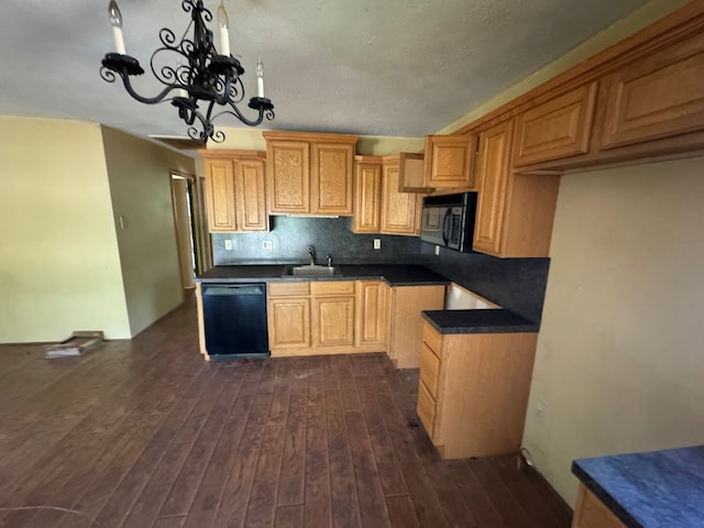 kitchen with sink, a chandelier, black appliances, dark hardwood / wood-style floors, and decorative backsplash