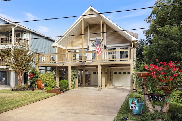 view of front facade featuring a balcony and a garage