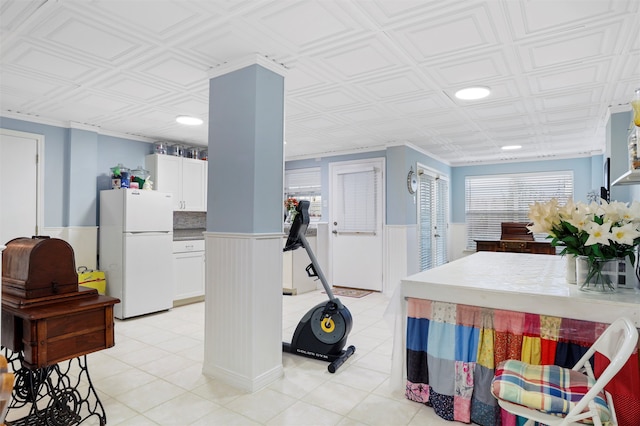 exercise room with light tile patterned floors