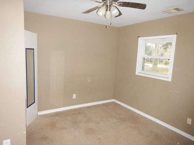 carpeted empty room with ceiling fan