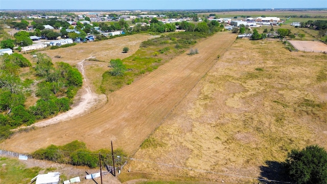 birds eye view of property with a rural view