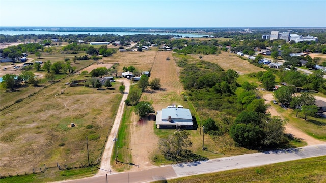 drone / aerial view with a water view and a rural view