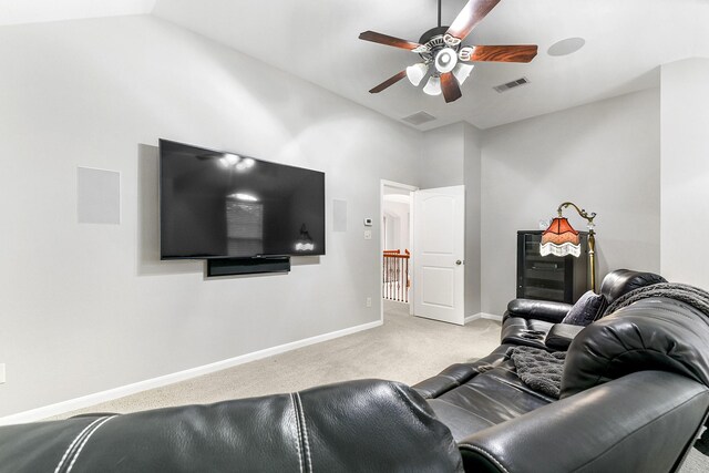 carpeted living room featuring lofted ceiling and ceiling fan