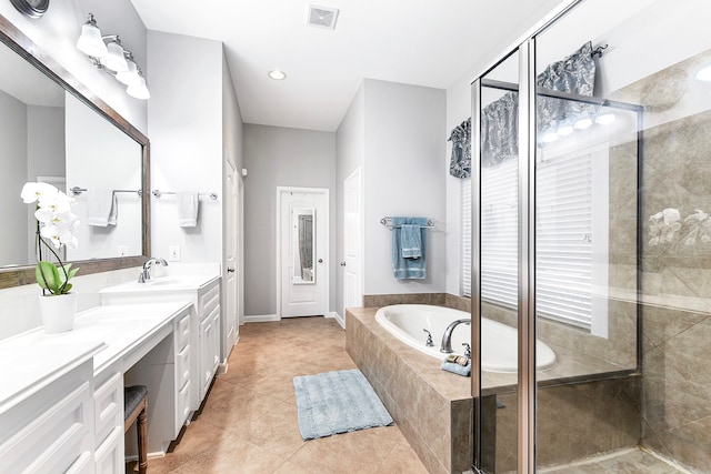 bathroom with separate shower and tub, tile patterned flooring, and dual bowl vanity