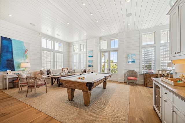 playroom featuring light wood-type flooring, a wealth of natural light, wooden ceiling, and pool table