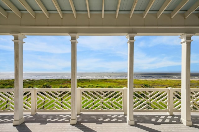 deck featuring a water view and a view of the beach