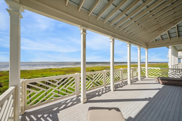 deck featuring a water view and a view of the beach