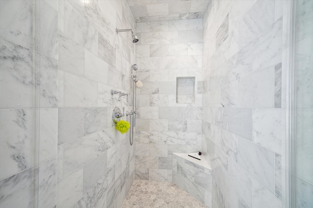 bathroom featuring tiled shower