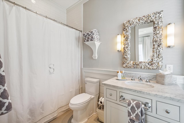 bathroom featuring tile patterned flooring, vanity, and toilet