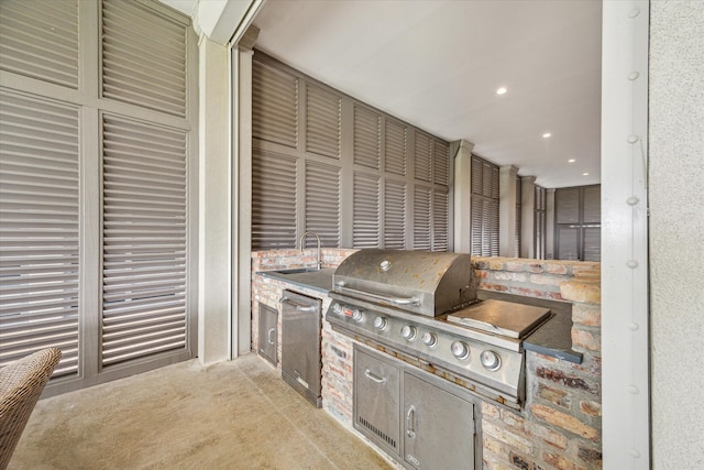 view of patio / terrace with sink, a grill, and exterior kitchen