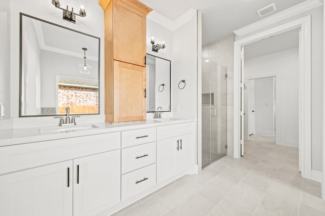 bathroom with vanity, crown molding, tile patterned flooring, and an enclosed shower