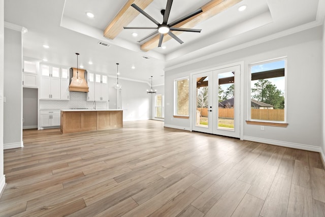 15408 Sandtrap Dr, Waller, TX 77484 - unfurnished living room with recessed lighting, ceiling fan, baseboards, light wood-type flooring, and a chandelier