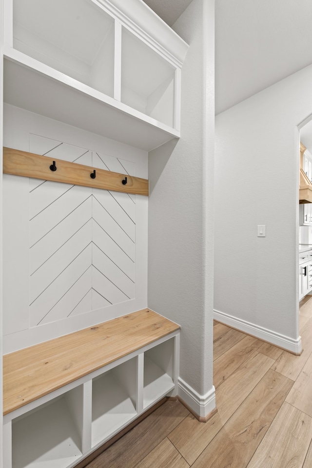 mudroom with hardwood / wood-style floors