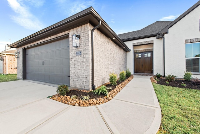 view of exterior entry featuring a garage