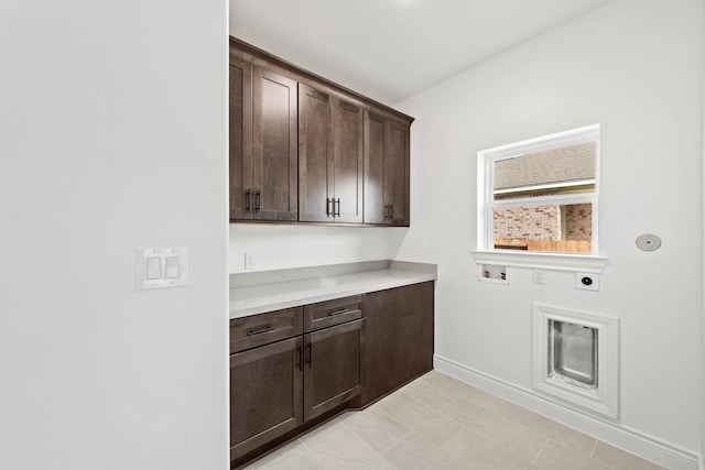 laundry area featuring hookup for a washing machine, cabinets, and electric dryer hookup