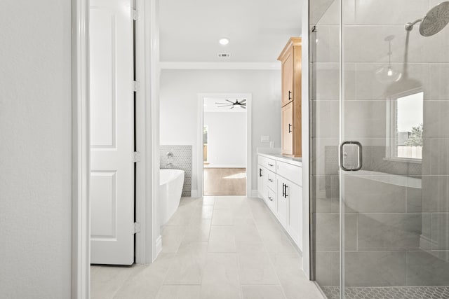 bathroom with tile walls, vanity, separate shower and tub, ceiling fan, and tile patterned floors