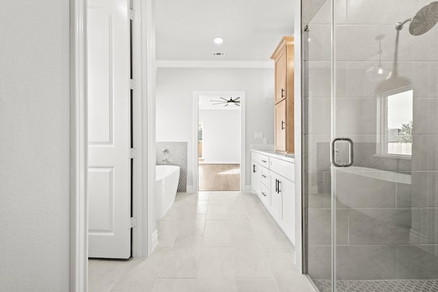 15408 Sandtrap Dr, Waller, TX 77484 - bathroom featuring a stall shower, tile patterned flooring, a soaking tub, vanity, and ceiling fan