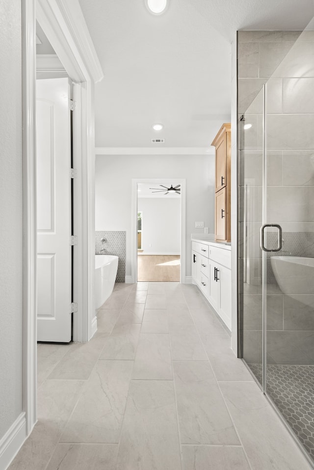 bathroom featuring ceiling fan, vanity, plus walk in shower, and ornamental molding