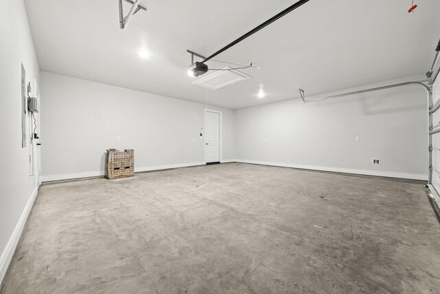 15408 Sandtrap Dr, Waller, TX 77484 - garage featuring a garage door opener and baseboards