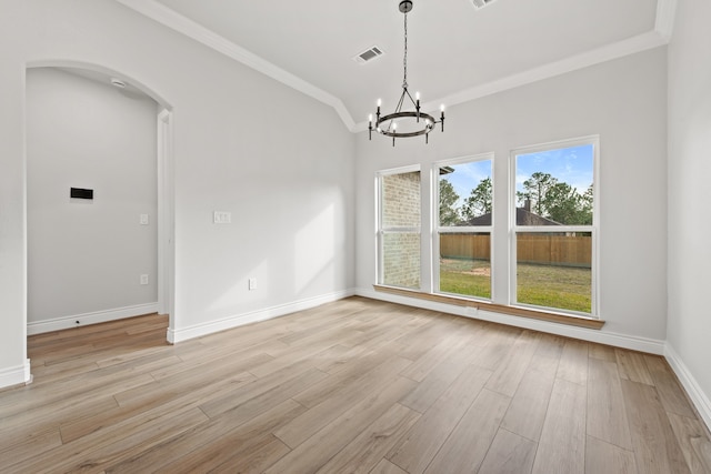 unfurnished room with light hardwood / wood-style flooring, plenty of natural light, ornamental molding, and a chandelier