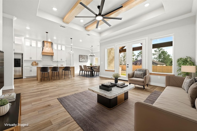 15408 Sandtrap Dr, Waller, TX 77484 - living room with recessed lighting, a raised ceiling, ceiling fan, light wood-style floors, and ornamental molding