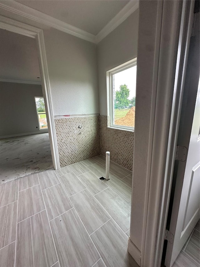 15408 Sandtrap Dr, Waller, TX 77484 - washroom with tile walls, wainscoting, and ornamental molding