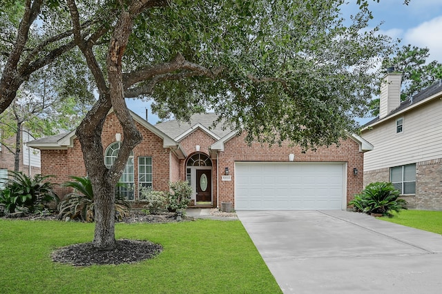 view of front facade with a garage and a front lawn