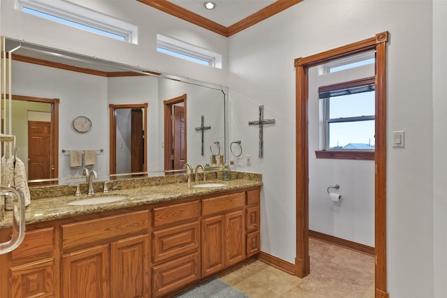 bathroom featuring crown molding and vanity