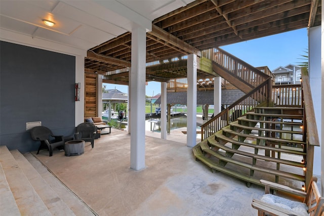 view of patio with a water view