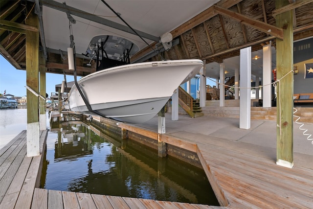 dock area with a water view