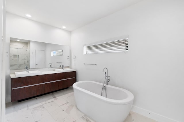 bathroom with vanity and independent shower and bath