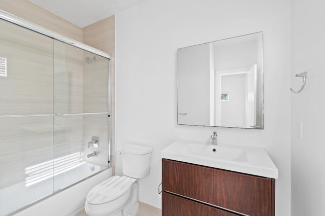 full bathroom with vanity, toilet, and shower / bath combination with glass door