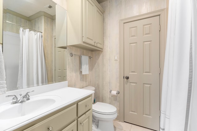 bathroom featuring vanity, toilet, a shower with shower curtain, and tile patterned floors