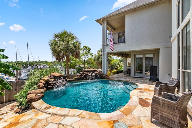 view of pool featuring a patio and pool water feature