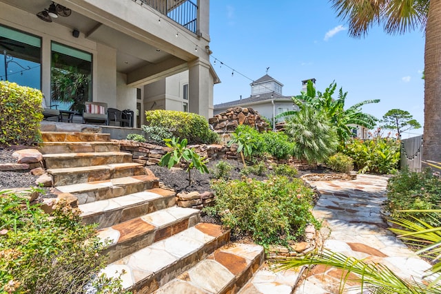 view of yard with a patio and a balcony