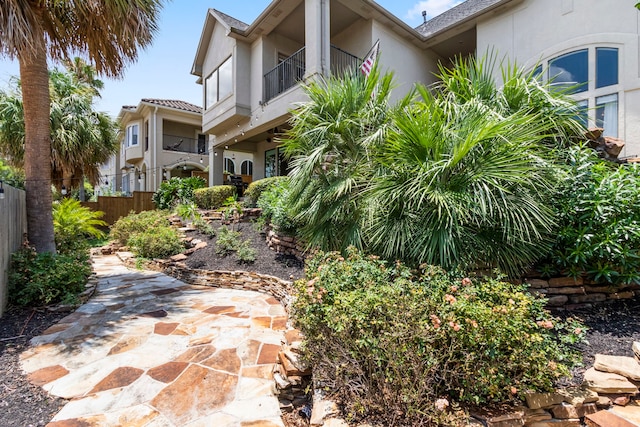 view of property exterior with a balcony